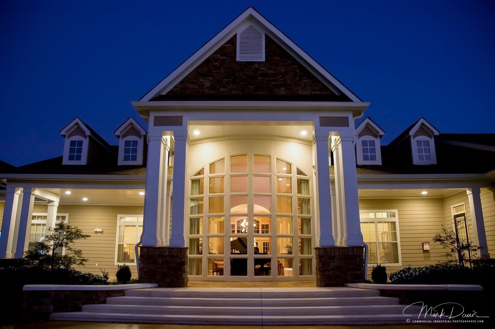 Blue hour exterior photography of an apartment clubhouse entrance