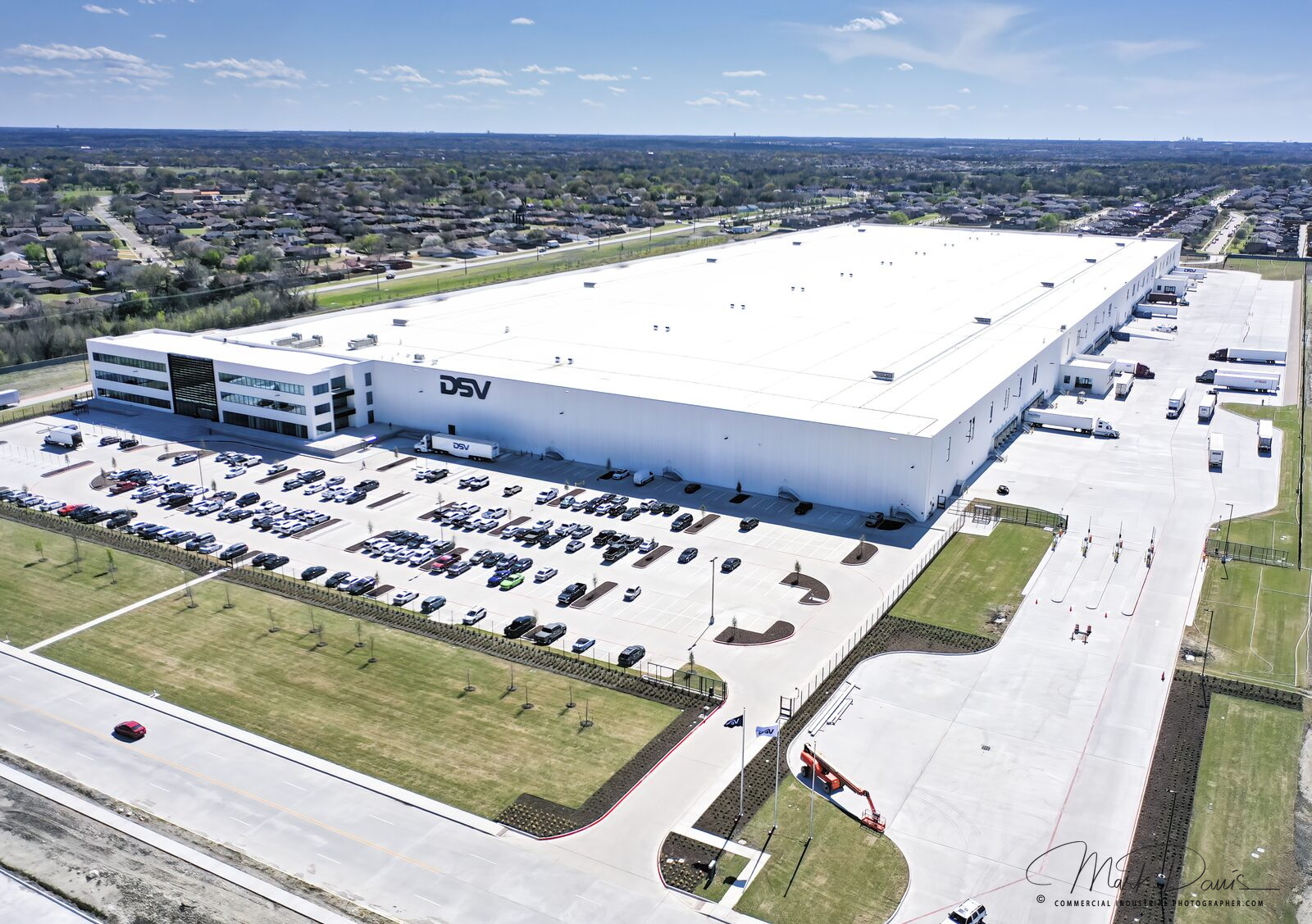 Aerial drone photograph of a large commercial warehouse facility