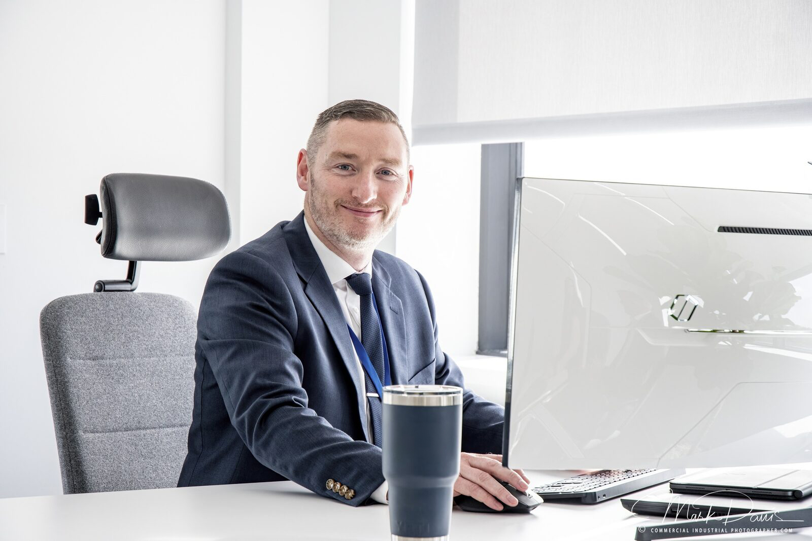 Corporate executive environmental portrait at his desk