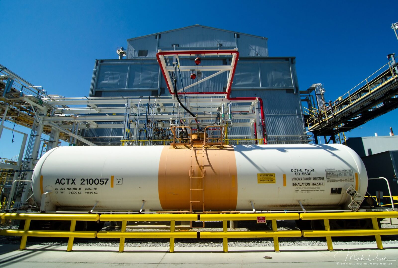 Railroad tanker car for hazardous materials at an industrial rail facility